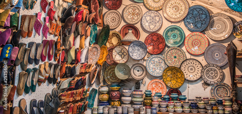 Ceramics and slippers for sale in souk, Marrakesh, Morocco photo