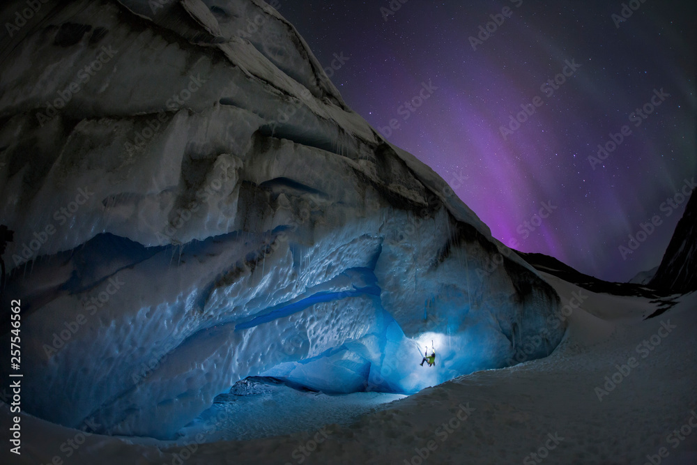 Ice climbing under aurora borealis