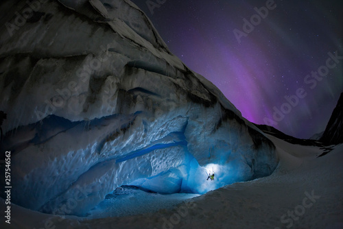 Ice climbing under aurora borealis