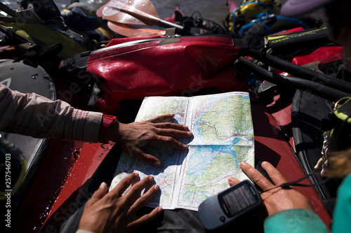 Two women operating GPS system for navigational assistance photo