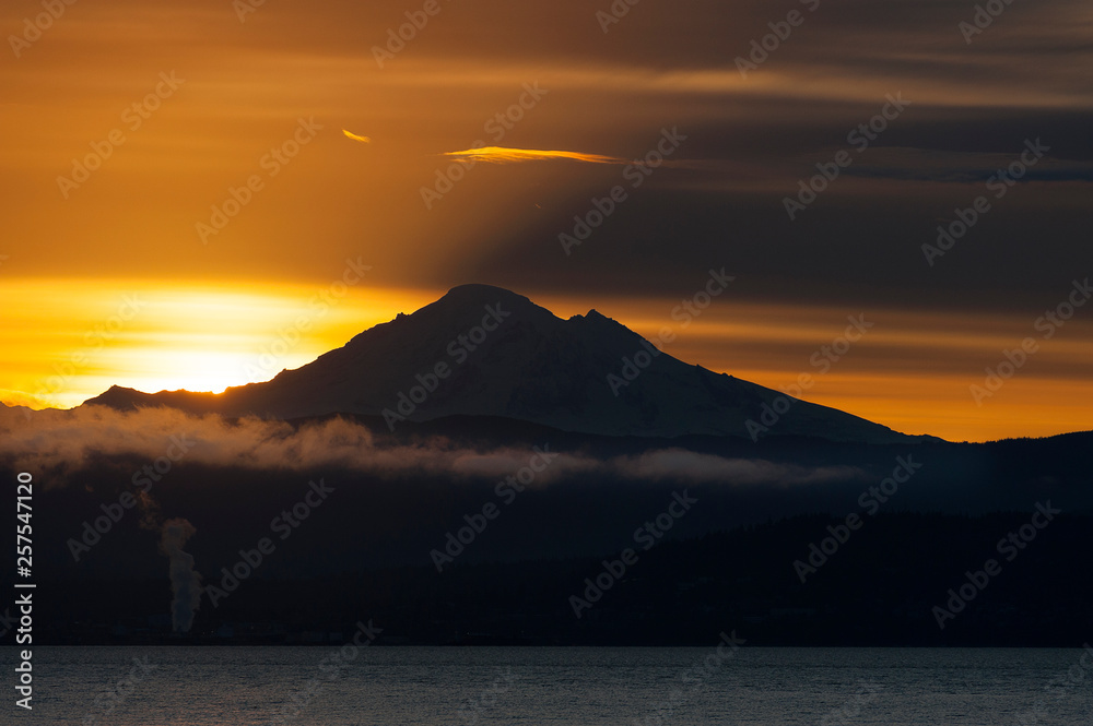 Sunrise Over the Active Volcano, Mt. Baker, in the North Cascade Mountain Range. Mt. Baker is one of the snowiest places in the world and is located 31 miles east of Bellingham, Washington.