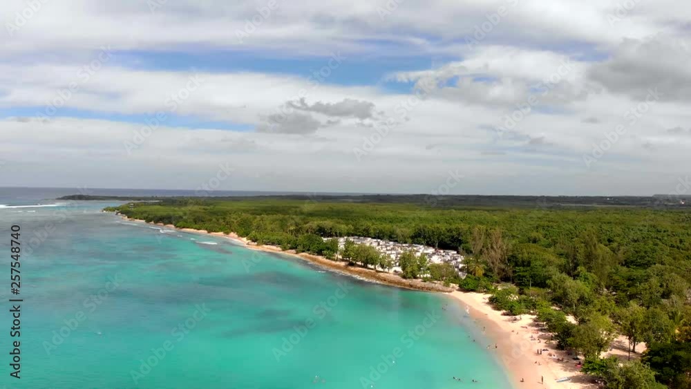 Phenomenal half turn aerial shot over a tropical beach on a beautiful sunny day Phenomenal half turn aerial shot over a tropical beach on a beautiful sunny day