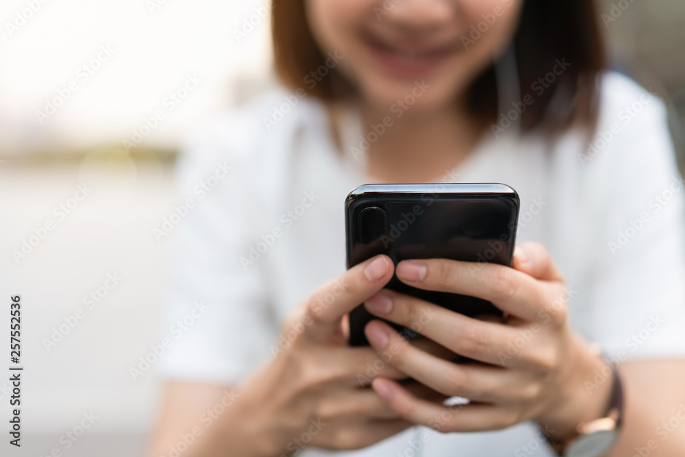 Woman using smartphone, During leisure time. The concept of using the phone is essential in everyday life. Woman using smartphone, During leisure time. The concept of using the phone is essential in everyday life.