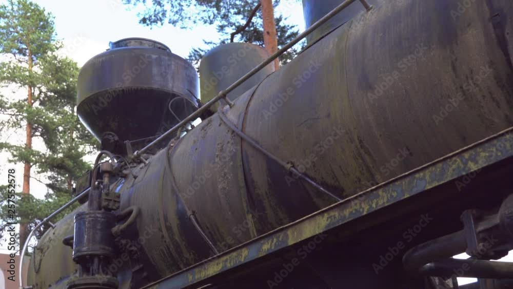An old locomotive train on the forest noe being used inside the military base An old locomotive train on the forest noe being used inside the military base