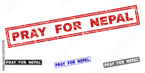 Grunge PRAY FOR NEPAL rectangle stamp seals isolated on a white background. Rectangular seals with grunge texture in red, blue, black and gray colors.