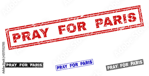 Grunge PRAY FOR PARIS rectangle stamp seals isolated on a white background. Rectangular seals with grunge texture in red, blue, black and gray colors.