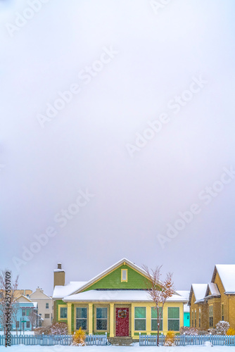 Facade of home against vast sky viewed in winter