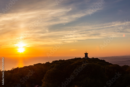 View of the beautiful sunset over the Black Sea coast from the observation tower from Mount Akhun in Sochi, Russia