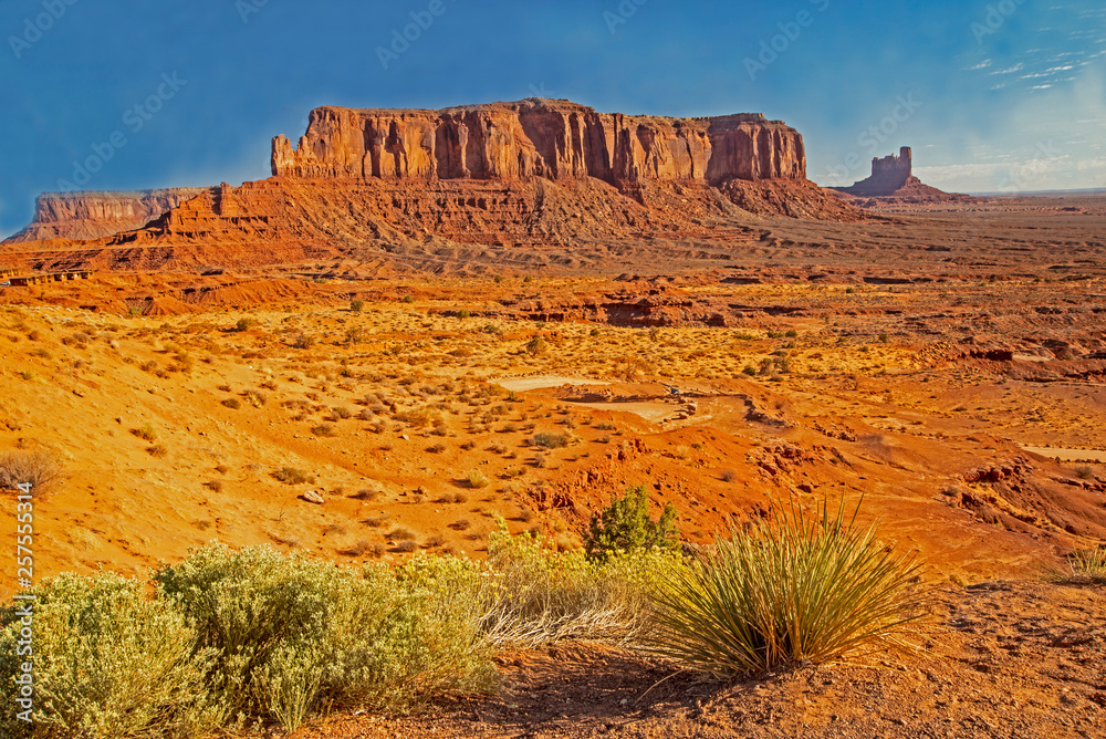 Monument Valley famous rock formations under a blue sky. Monument Valley famous rock formations under a blue sky.