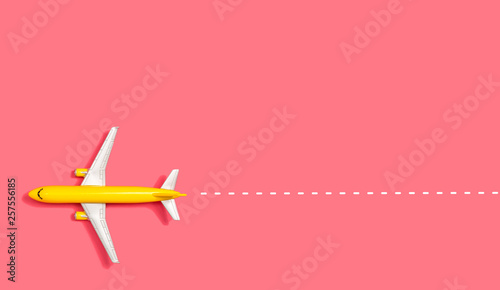 Toy miniature airplane overhead view flat lay