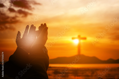 Christian woman praying worship at sunset. Hands folded in prayer. worship god with christian concept religion. Eucharist Therapy Bless God Helping Repent Catholic Easter Lent Mind Pray.