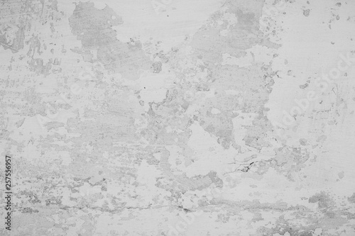The texture of the old cement wall with scratches, cracks, dust, crevices, roughness, stucco. Can be used as a poster or background for design.
