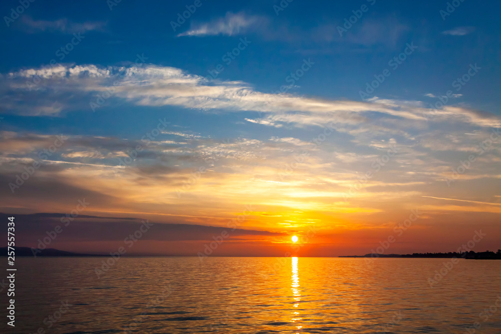 Sunrise over the Balaton lake, Hungary. Pastel morning colors of the lake and sky