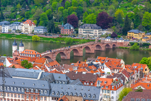 Aerial view of Heidelberg city, Baden-Wurttemberg state, Germany. Old town (Altstadt) and Old Karl Theodor bridge (Alte Brucke) over Neckar river on a background. View from Heidelberg Castle photo