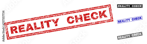 Grunge REALITY CHECK rectangle stamp seals isolated on a white background. Rectangular seals with grunge texture in red, blue, black and gray colors.
