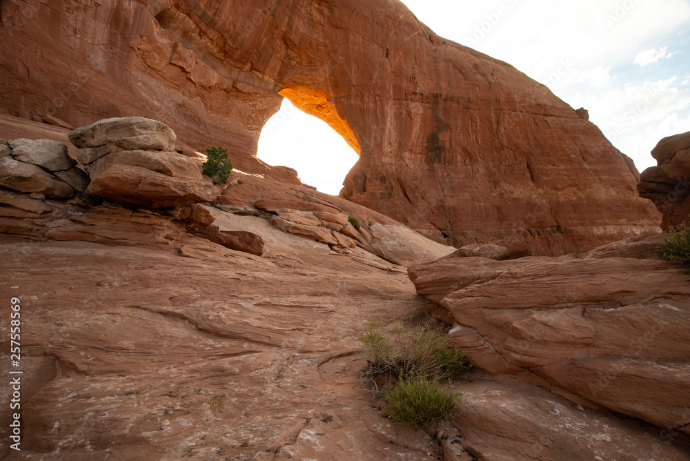 Natural stone arches at sunrise in Canyonlands National Park.