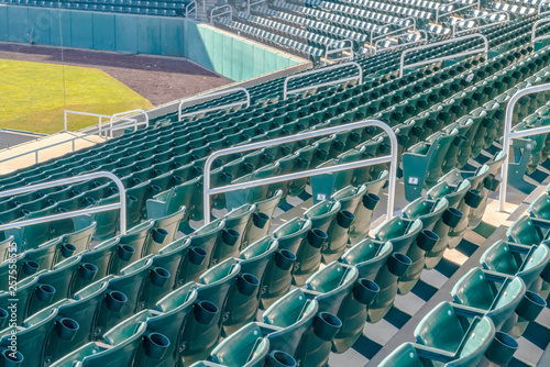 Tiered seating at a sports arena on a sunny day