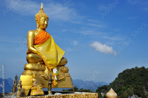 golden sitting buddha in tiger temple in Crabi photo