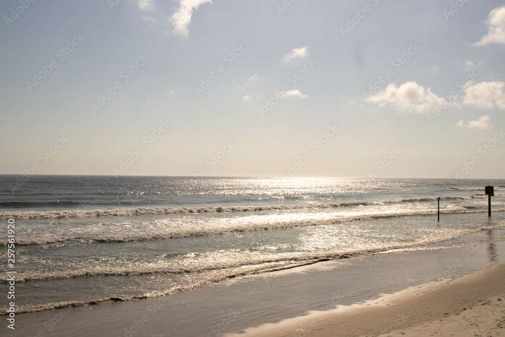 Looking out into the ocean directly at the rising sun