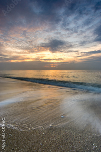 Beautiful Tropical seascape wave movement during sunrise © Thapanon Phoonchai