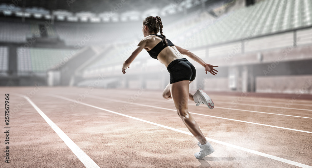Obraz premium Sportswoman running race. Mixed media