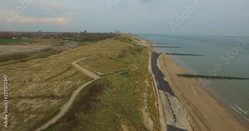 Aerial: The city of Vlissingen located at the North sea during sunset. photo