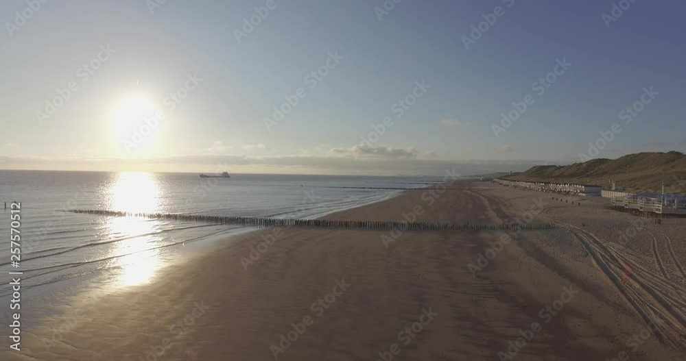 Aerial: The beach between Vlissingen and Dishoek during sunset. Aerial: The beach between Vlissingen and Dishoek during sunset.