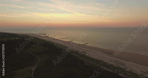 Aerial: The beach between Vlissingen and Dishoek during sunset. photo