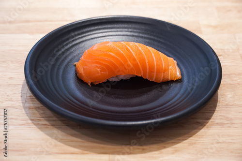 Salmon sushi nigiri, Sushi bar menu, Sushi, traditional Japanese food on ceramic dish, Japanese food style, selective focus.