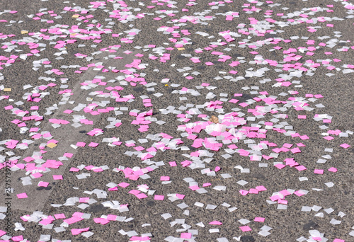 Small square paper confetti on the ground