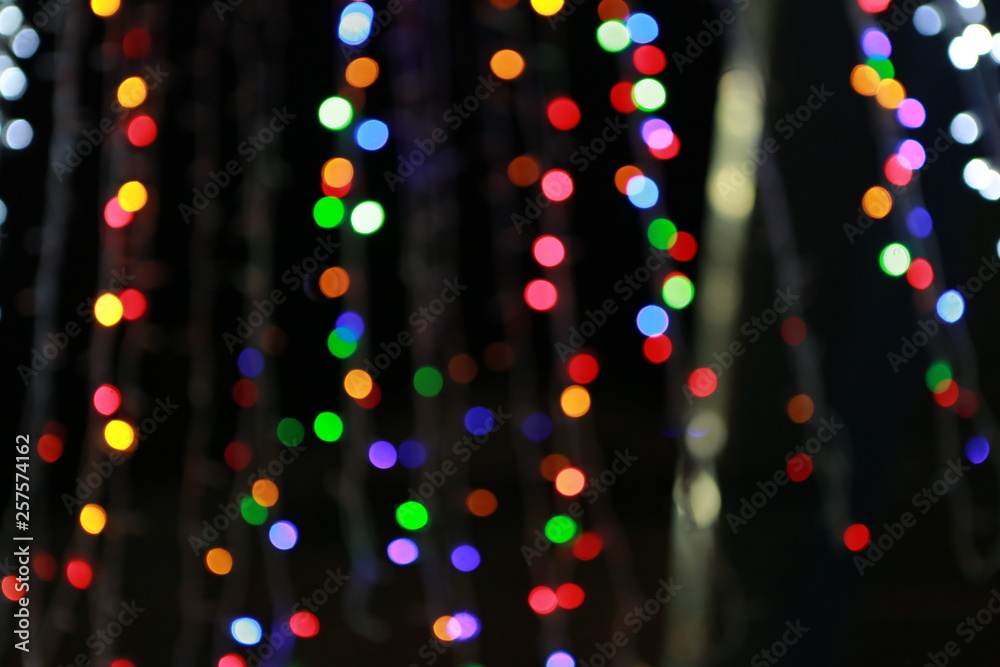Φωτογραφία A Bokeh with colorful lights festival background.