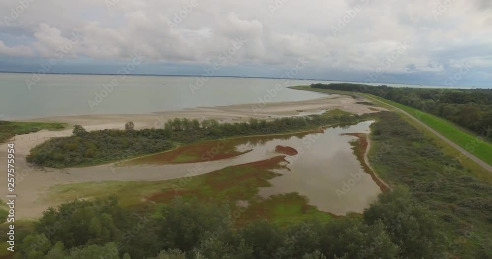 Aerial: Nature located next to a port in Vlissingen, the Netherlands. Aerial: Nature located next to a port in Vlissingen, the Netherlands.