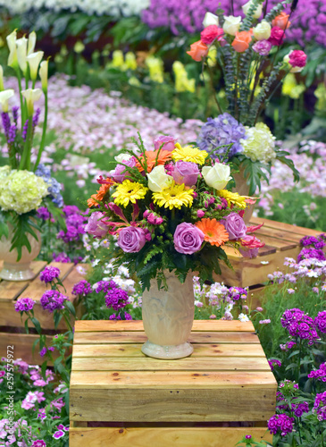 Flower in vase on wooden box show at flora exhibition, beautiful flowery pattern, garden decorative, art of bouquet design, flower bouquet design, flower bouquet style, flowery garden, flowering plant