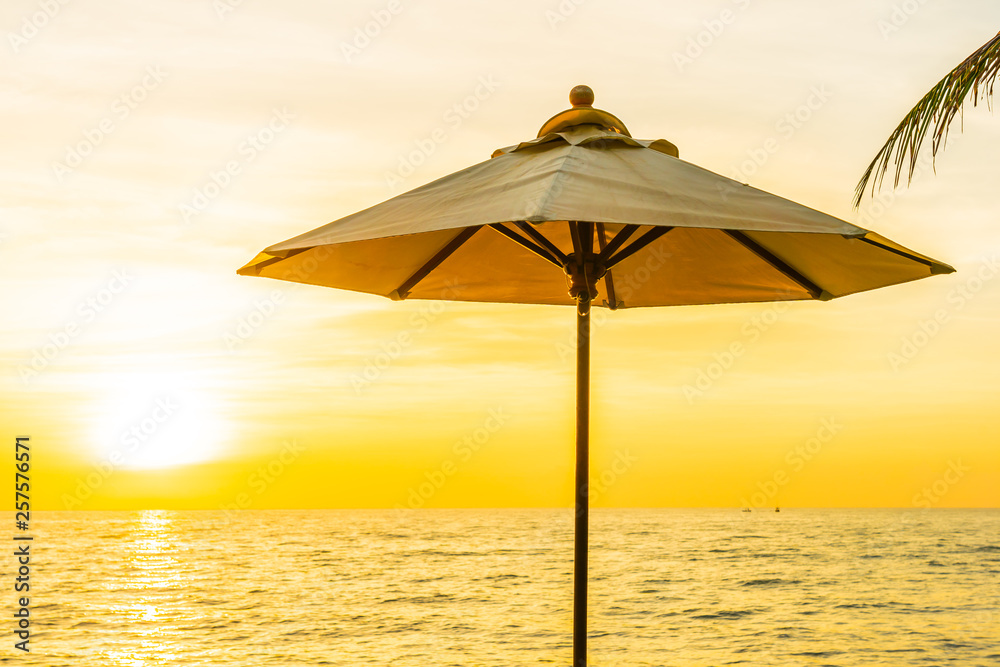 Beautiful Landscape of sea ocean on sky with umbrella and chair around there at sunset