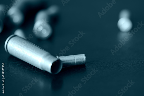 Empty old bullet cartridges close up. Blue color toned