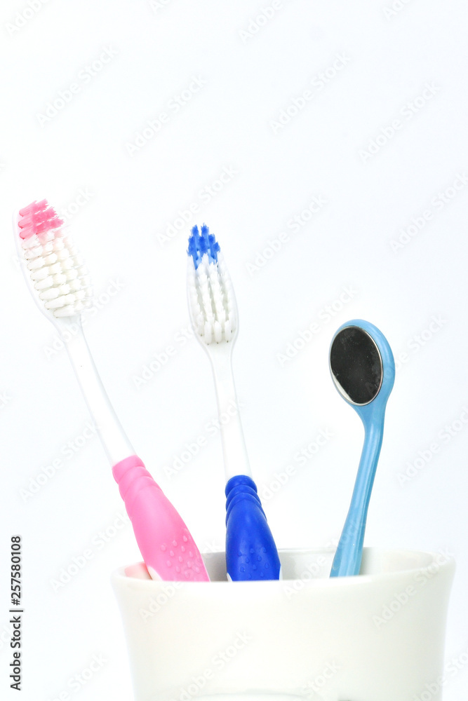 tooth brushes in glass tooth brushes in glass