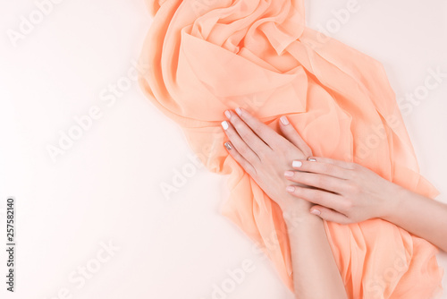 Manicure and textile background.