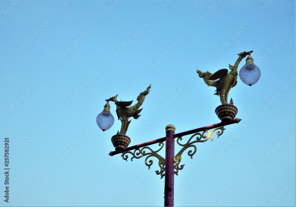 The beautiful elegance designed lamps on the metal pole with clear blue sky on the background, Huahin Thailand. The beautiful elegance designed lamps on the metal pole with clear blue sky on the background, Huahin Thailand.