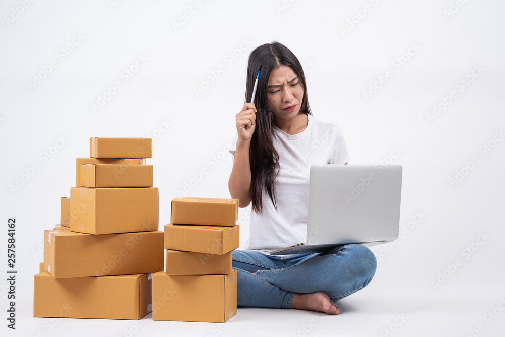 Happy women from ordering products from customers, business owners who work at home on a white background, Online shopping business operators Independent work concept. Happy women from ordering products from customers, business owners who work at home on a white background, Online shopping business operators Independent work concept.