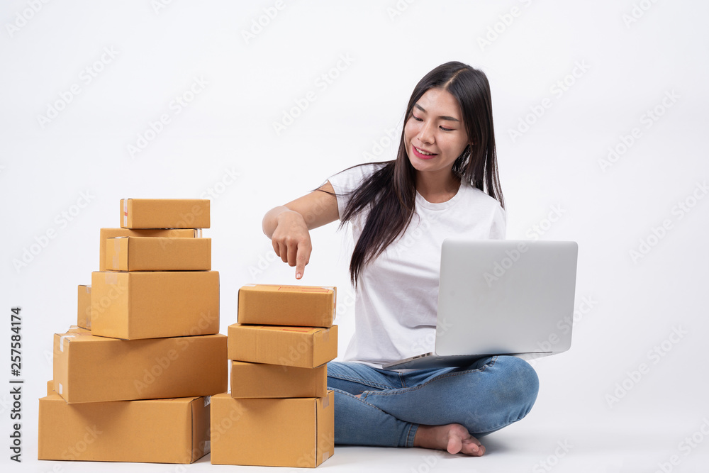 Happy women from ordering products from customers, business owners who work at home on a white background, Online shopping business operators Independent work concept. Happy women from ordering products from customers, business owners who work at home on a white background, Online shopping business operators Independent work concept.