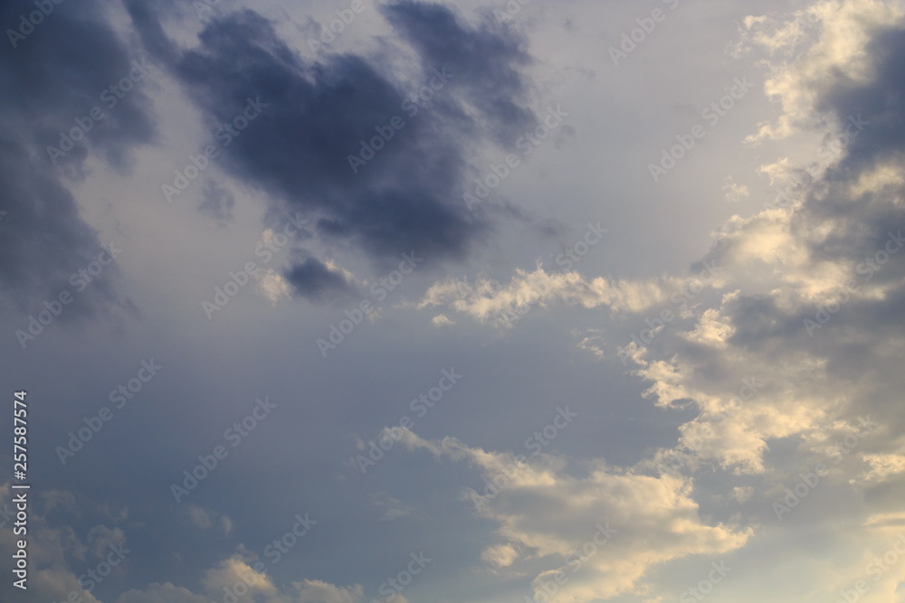 Obraz premium Clouds after rain before sunset as a background