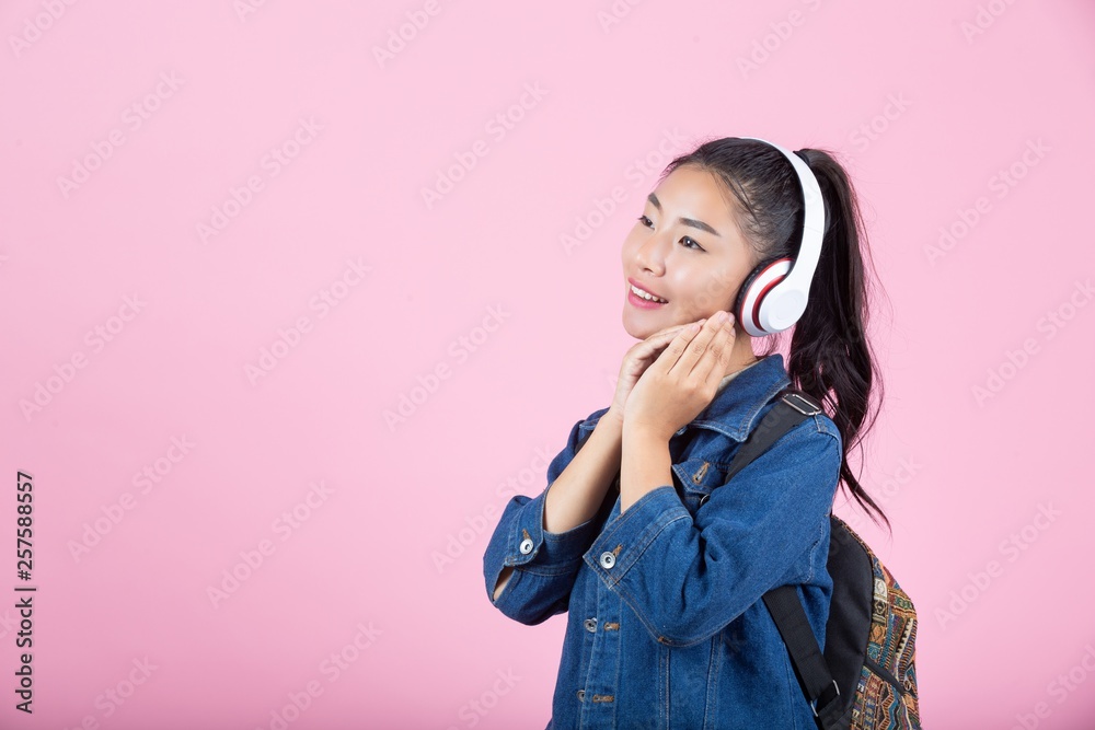 Female tourists in the studio on a pink background. Female tourists in the studio on a pink background.