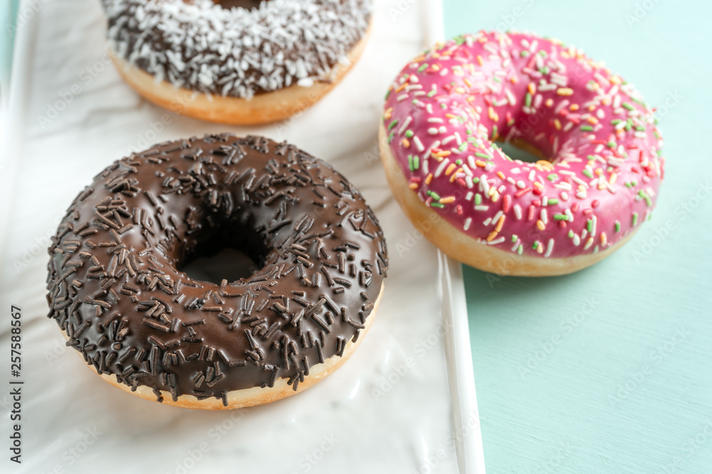 A group of donuts on a blue background. A group of donuts on a blue background.