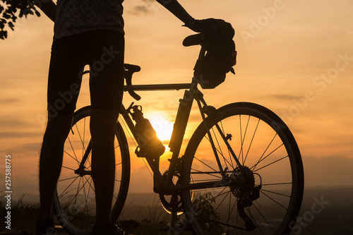 silhouette cyclist at sunset time