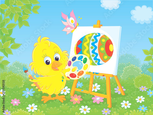 Little yellow chick drawing a colorful Easter egg among flowers on green grass of a lawn on a sunny spring day, vector illustration in a cartoon style
