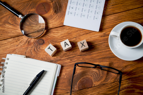 business desk. Pen,glasses, calculator, tax