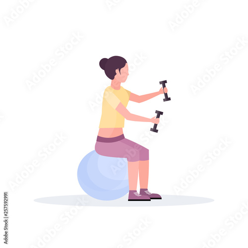 sporty woman sitting fitness ball girl holding dumbbells doing exercises training in gym aerobic pilates workout healthy lifestyle concept flat white background