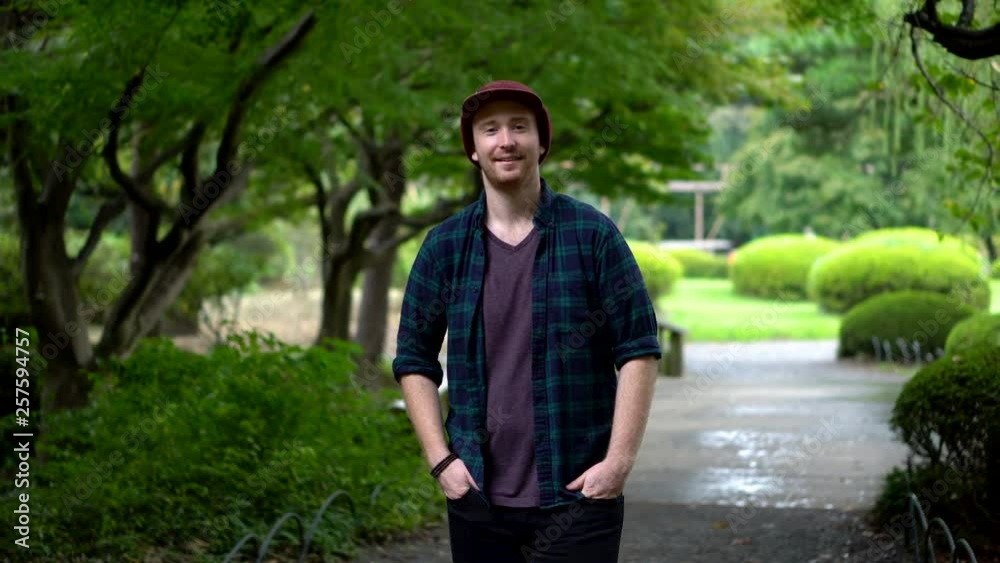 Smiling Caucasian Tourist in Japanese Garden Smiling Caucasian Tourist in Japanese Garden