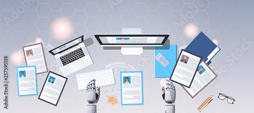 robot hands choosing cv resume profile business people to hire hr bot workplace curriculum vitae recruitment candidate job position top angle view desktop horizontal