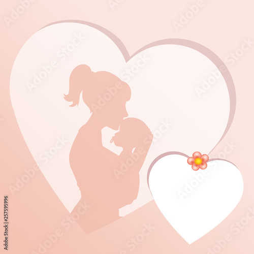 mother kissing baby in the heart frame